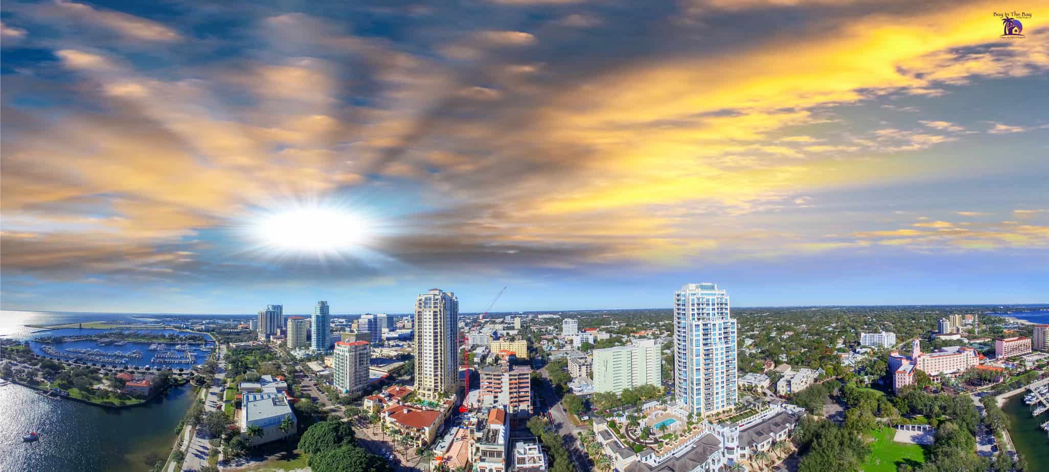 ariel view of the sunset over St. Pete in Pinellas County Florida with water and buildings