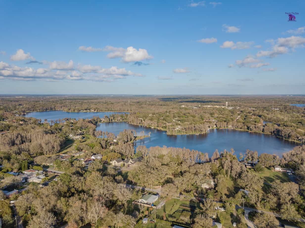 ariel view of crystal lake in lutz with view of rooftops around lake