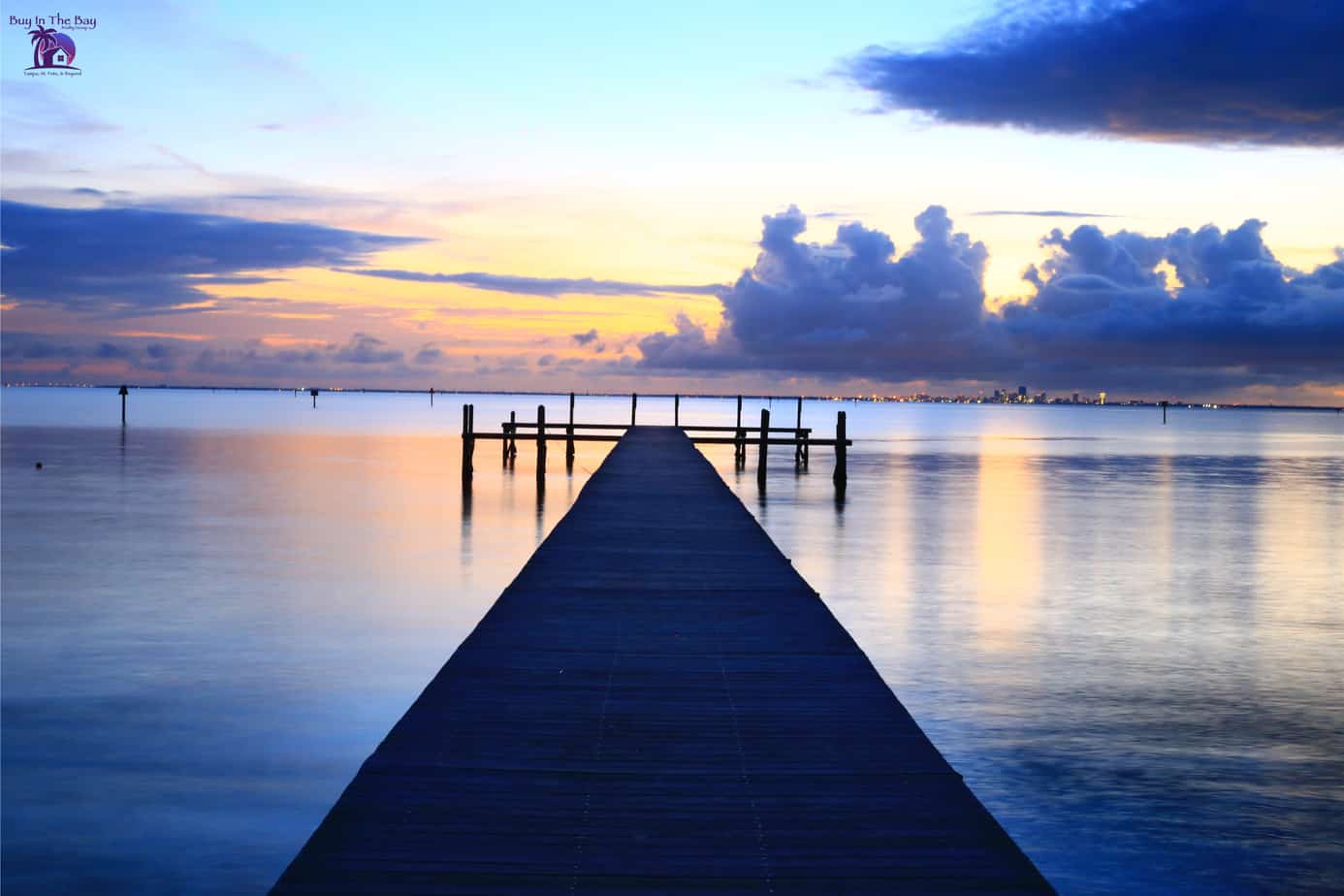 Sunset at Little Harbor in Ruskin FL with dock on water