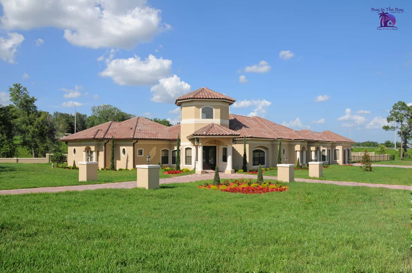 yellow home with tile barrel roof and land similar to a home found in Dover Florida