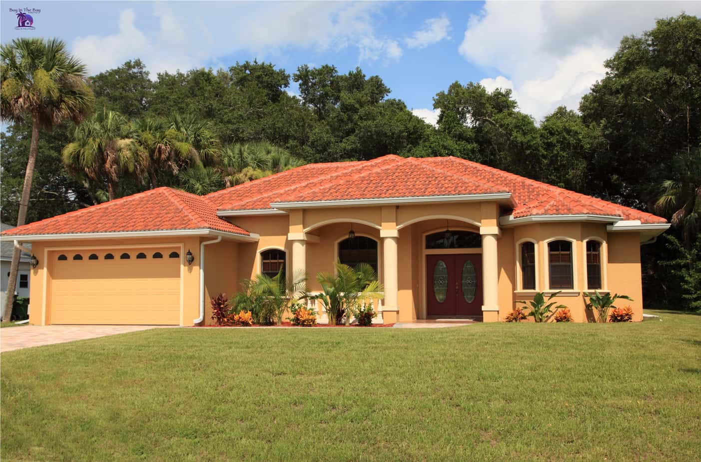 yellow one story home with red tile barrel roof similar to a home in Mango Florida