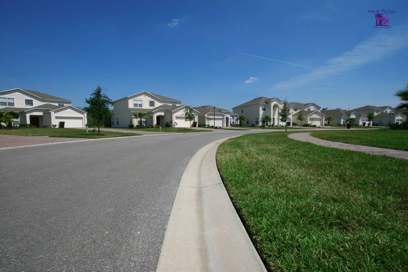 two store white homes in master planned community that would look similar to homes in Gibsonton Florida