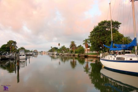 Image showing multiple Docked boats on the water in Boca Ciega Bay Madeira Beach Florida in the zip code of 33708 with a nice sunset in th ebackground