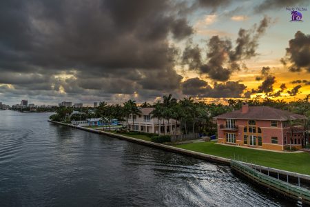 view of multi colored homes on the water with the sunset in the back showing homes for sale beach park tampa fl and beach park isles tampa fl