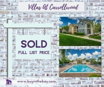 Sold thumbnail of a home at the Villas Of Carrolwood with brick background and sold sign